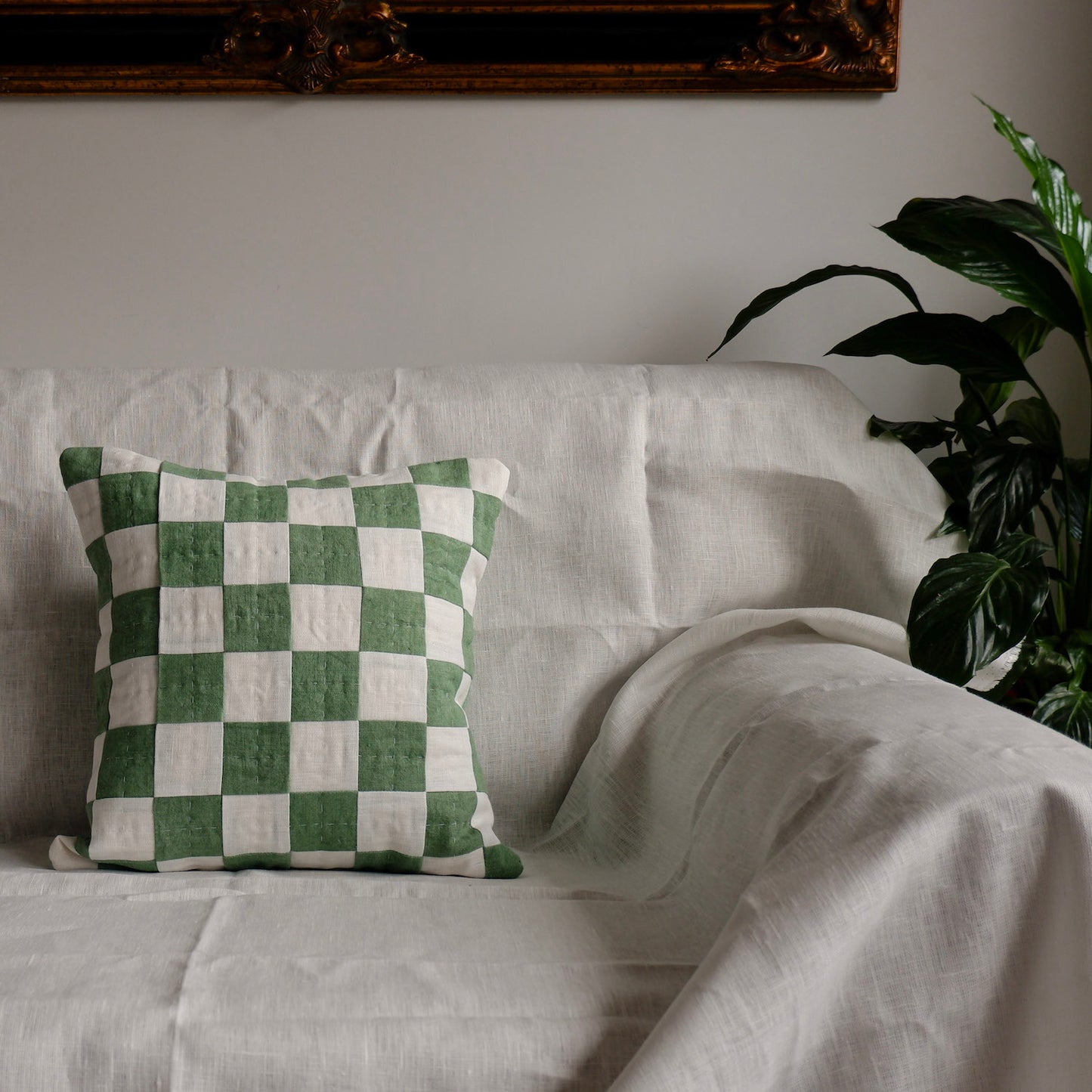 Green chequered cushion made with naturally-dyed linen